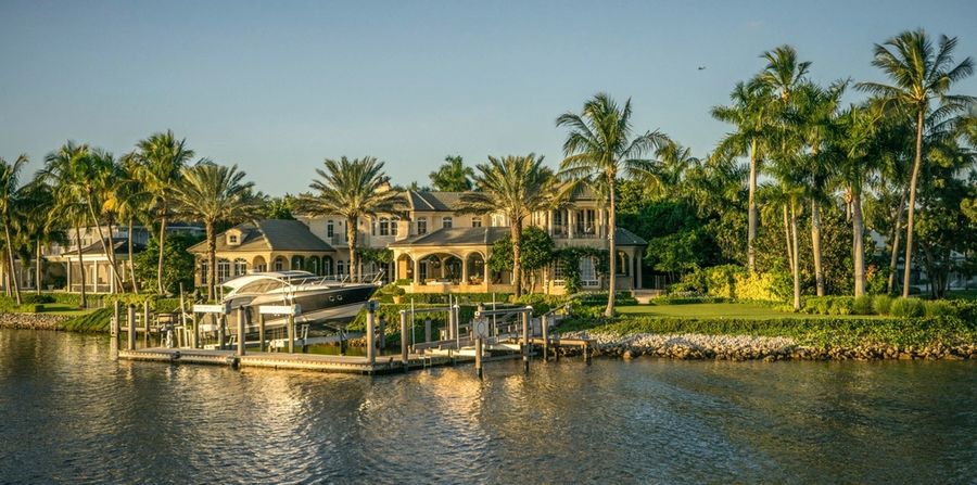 Homes along a palm-lined waterway