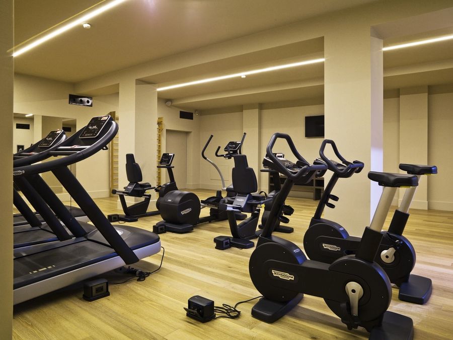 Bright fitness studio with cardio equipment