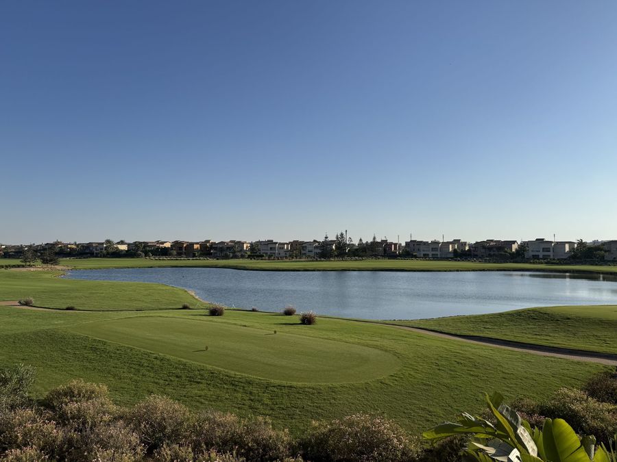 Fairway and pond with homes along the course
