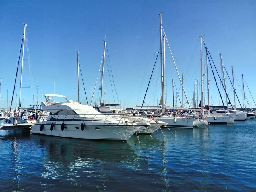 Yachts and sailboats in a calm marina